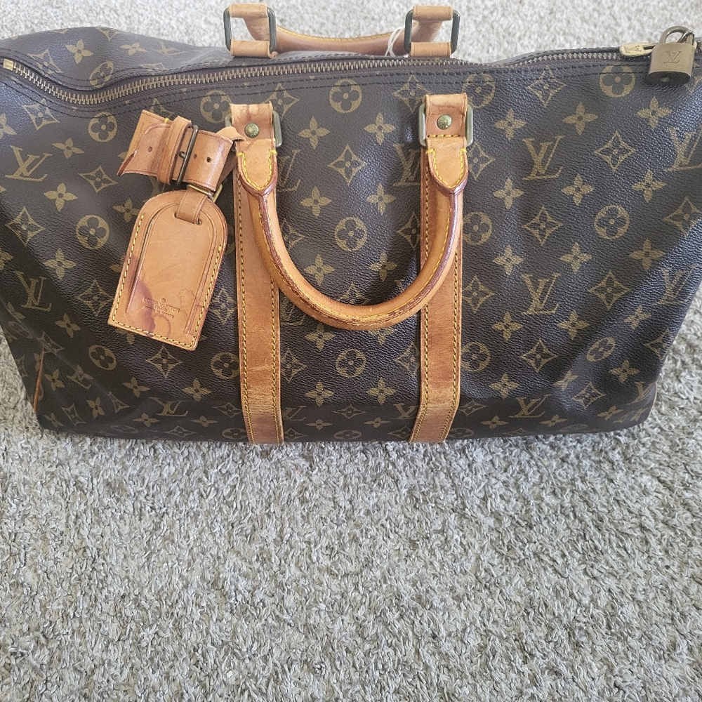 Authentic Vintage Louis Vuitton Keepall  with luggage tag & lock (COA) included